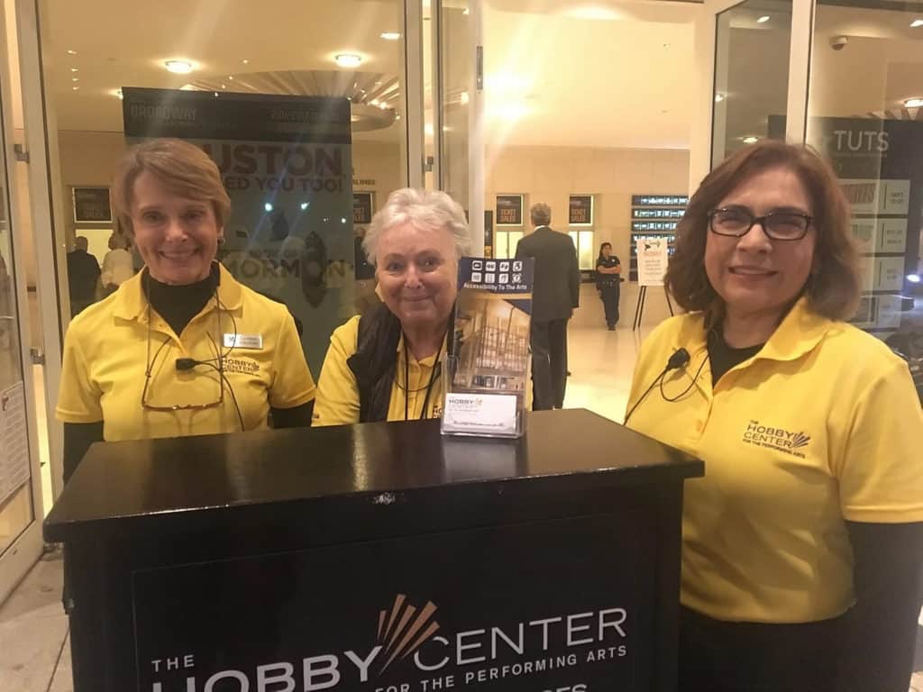 volunteers in golden shirts