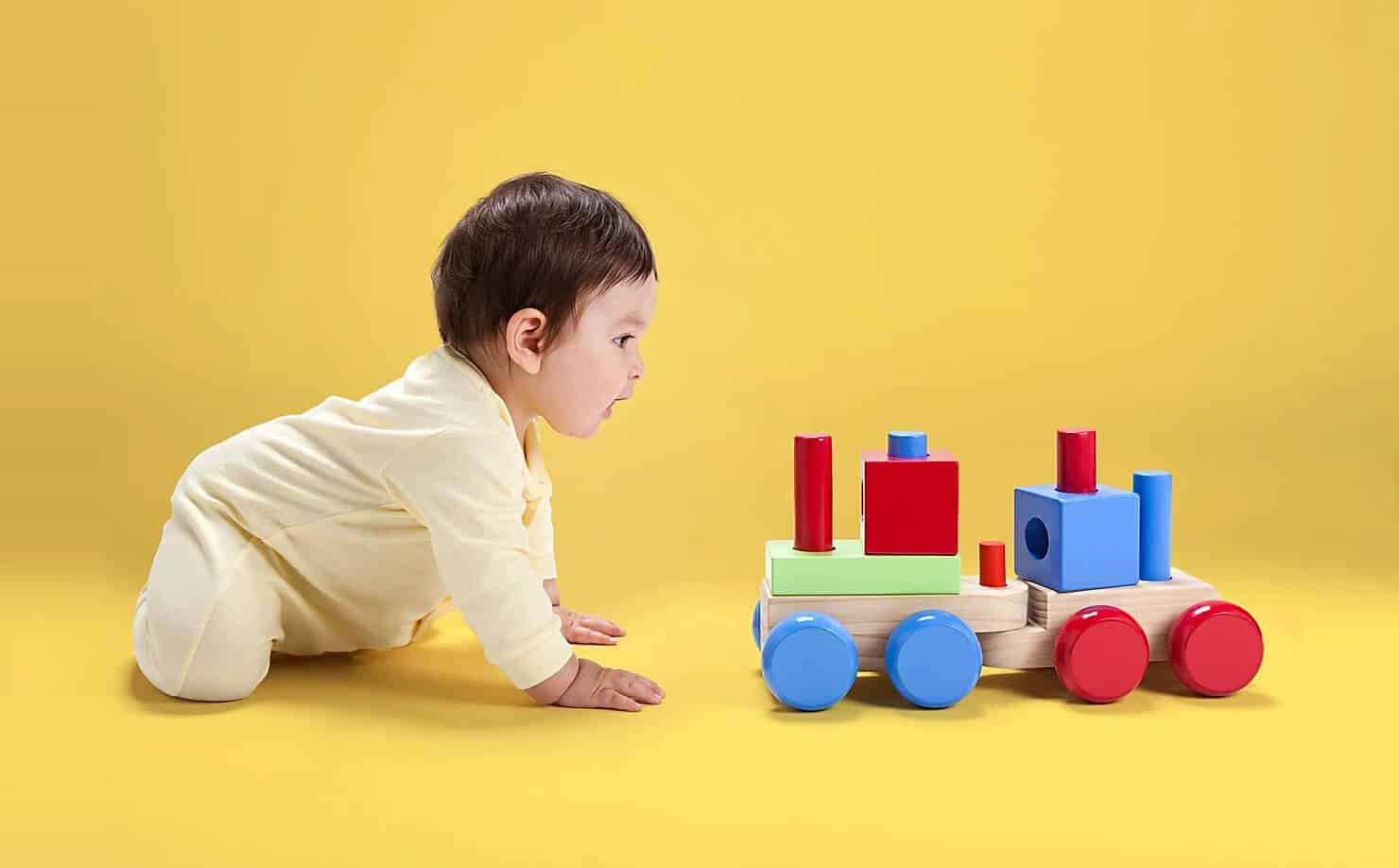 Baby Plays with Toy Train
