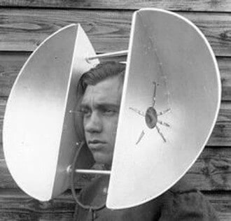 Man with large cupping device around ears